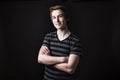 Young teenage boy being photographed in a studio. Royalty Free Stock Photo