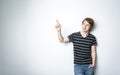 Young teenage boy being photographed in a studio. Royalty Free Stock Photo