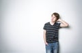 Young teenage boy being photographed in a studio. Royalty Free Stock Photo