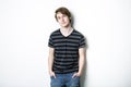 Young teenage boy being photographed in a studio. Royalty Free Stock Photo