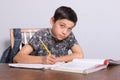 Young teenage boy doing his homework Royalty Free Stock Photo