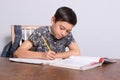 Young teenage boy doing his homework Royalty Free Stock Photo