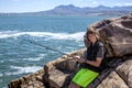 Young teenage boy fishing by the sea Royalty Free Stock Photo