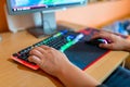 Young teenage boy playing video games on computer Royalty Free Stock Photo