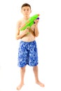 Young teenage boy playing with water guns Royalty Free Stock Photo