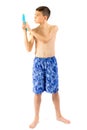 Young teenage boy playing with water guns Royalty Free Stock Photo