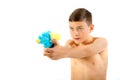 Young teenage boy playing with water guns Royalty Free Stock Photo