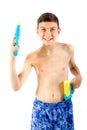 Young teenage boy playing with water guns Royalty Free Stock Photo