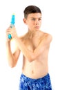 Young teenage boy playing with water guns Royalty Free Stock Photo