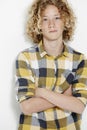 Young teenage boy standing in studio Royalty Free Stock Photo