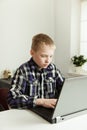 Young Teenage Boy Using Laptop Computer at Desk Royalty Free Stock Photo