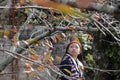 Young teenage enjoy the beauty of autumn leave at Philosopher`s Path in Kyoto, Japan