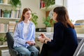 Young teenage female patient talking to professional mental therapist Royalty Free Stock Photo