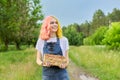 Young teenage girl with basket of fresh plucked strawberries Royalty Free Stock Photo
