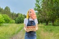 Young teenage girl with basket of fresh plucked strawberries Royalty Free Stock Photo