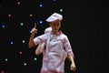 Young teenage girl in chefs cook`s uniform Royalty Free Stock Photo