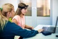 Young teenage girl and child therapist during EEG neurofeedback session. Electroencephalography concept.