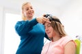 Young teenage girl and child therapist during EEG neurofeedback session. Electroencephalography concept. Royalty Free Stock Photo