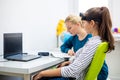 Young teenage girl and child therapist during EEG neurofeedback session. Electroencephalography concept. Royalty Free Stock Photo