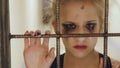Young teenage girl dancer crying and suffering after loss perfomance stand near theatre door cage indoors Royalty Free Stock Photo