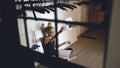 Young teenage girl dancer crying and tearing book sits on floor in hall indoors Royalty Free Stock Photo