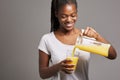 Young teenage girl drinking an orange juice Royalty Free Stock Photo