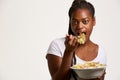 Young teenage girl eating salad Royalty Free Stock Photo