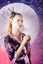 Young teenage girl in floral kimono in studio Royalty Free Stock Photo