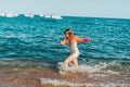 Young teenage girl having fun in the sea Royalty Free Stock Photo