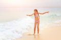 Young teenage girl having fun with waves on beach Royalty Free Stock Photo