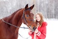 Young teenage girl with her horse in winter park Royalty Free Stock Photo