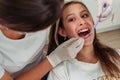 Young teenage girl with her mouth open for the dentist to check her teeth. concept of dental insurance, oral health Royalty Free Stock Photo