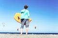 Waiting for surfing training. Young teenage girl standing with s Royalty Free Stock Photo