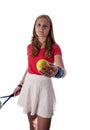 Young teenage girl holding a tennis racket and ball Royalty Free Stock Photo