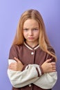 Young teenage girl with negative expression, angry in casual clothing and look at camera