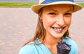 Young teenage girl outdoors eating black ice cream cone on the city Royalty Free Stock Photo