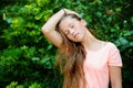 Young teenage girl in the park with calm facial expression. Royalty Free Stock Photo