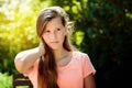 Young teenage girl in the park with calm facial expression. Royalty Free Stock Photo