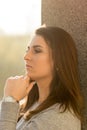 Young teenage girl portrait headshot against wall with serious look Royalty Free Stock Photo