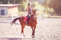 Young teenage girl riding her horse at training Royalty Free Stock Photo