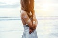 Young girl with silver tattoo and boho jewelry on sunset