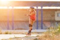 Young teenage girl speed skating on rollerdrome