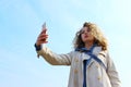 Young teenage girl take a selfie outdoor. People, travel, nature concept. Portrait of young teenage girl.