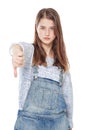 Young teenage girl with thumb down gesture isolated Royalty Free Stock Photo