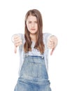 Young teenage girl with thumbs down gesture isolated Royalty Free Stock Photo