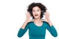 Young teenage girl wearing headphones listening and dancing to music isolated over white background. Happy girl. Royalty Free Stock Photo