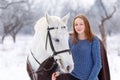 Young teenage girl with white horse in winter park Royalty Free Stock Photo