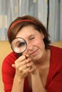 Young teenage holding a magnifying glass