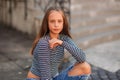 Young teenage poses for photo. blonde girl in jeans and blouse Royalty Free Stock Photo