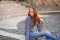 Young teenage poses for photo. blonde girl in jeans and blouse Royalty Free Stock Photo